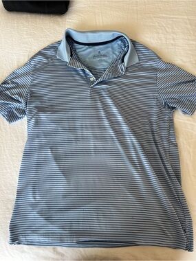 Brooks Brothers Light Blue and Navy Striped Polo with small hole